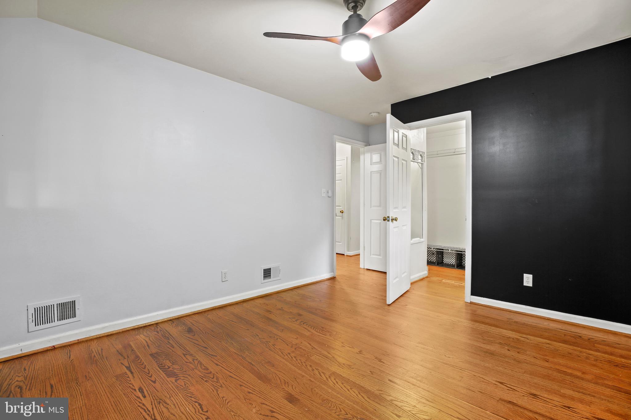 3303 Janet Road Silver Spring, MD 20906 - Photo 21 of 31 an empty room with wooden floor and windows