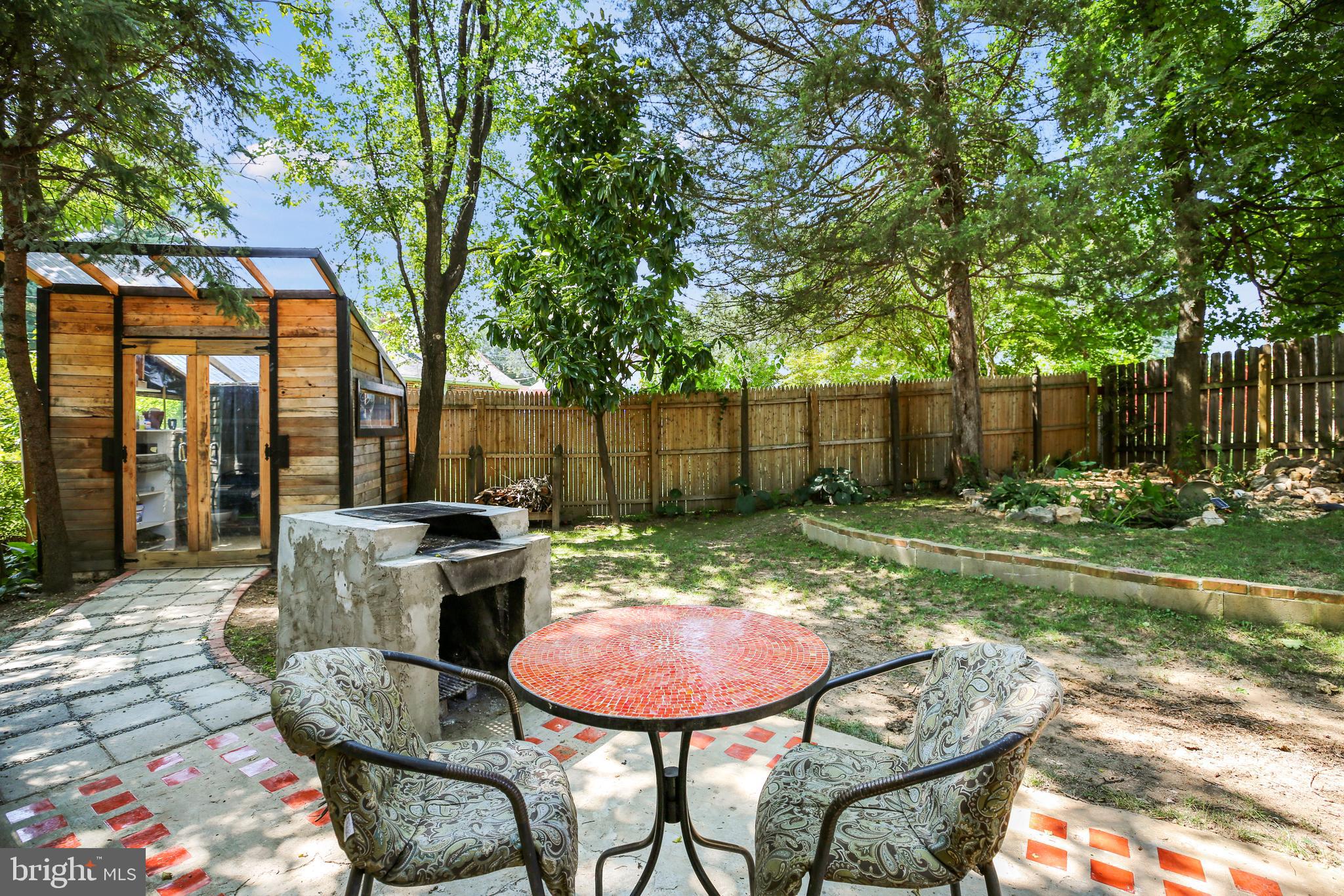 3303 Janet Road Silver Spring, MD 20906 - Photo 30 of 31 a backyard of a house with yard barbeque oven and outdoor seating