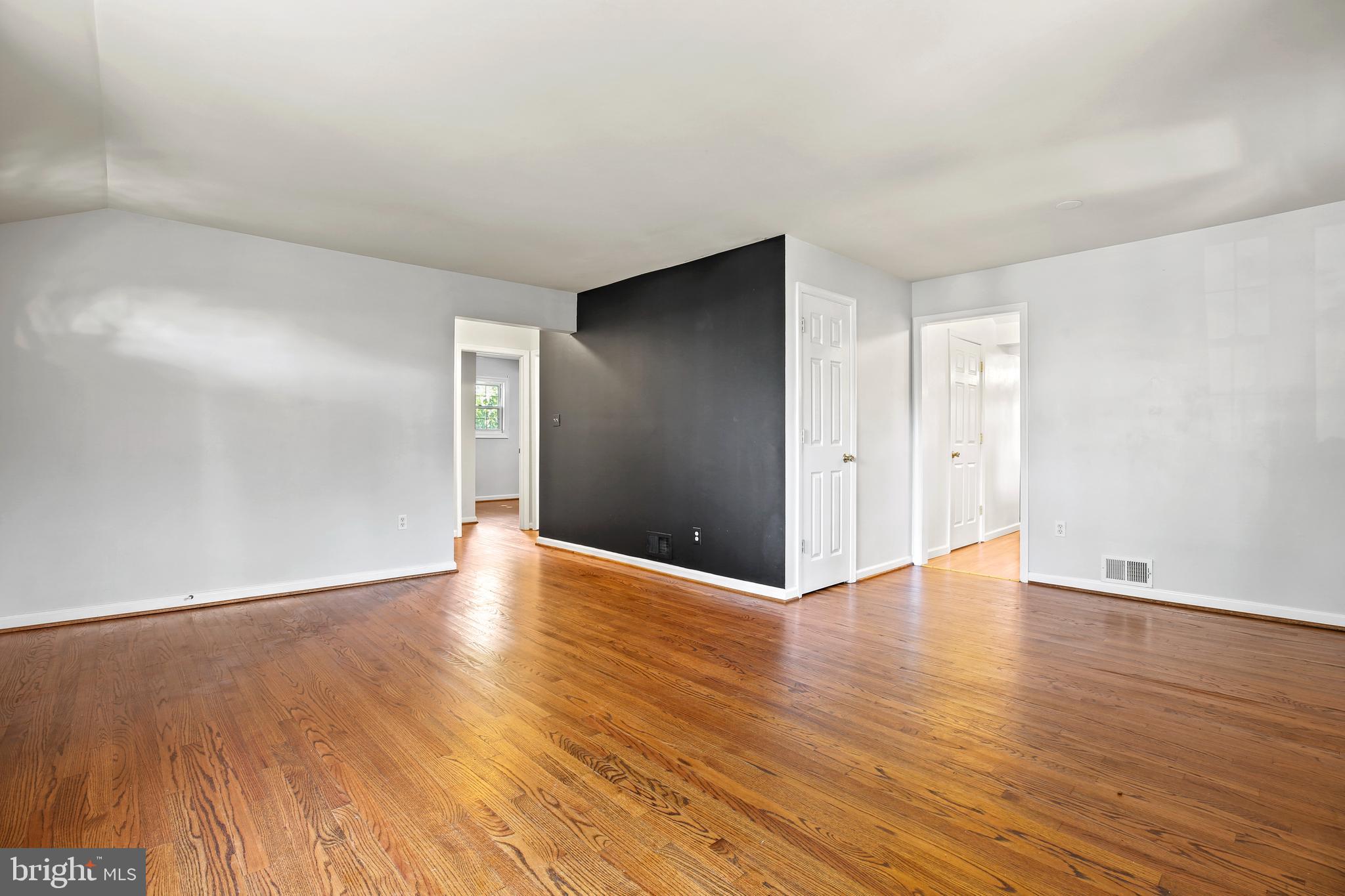 3303 Janet Road Silver Spring, MD 20906 - Photo 7 of 31 a view of an empty room with wooden floor