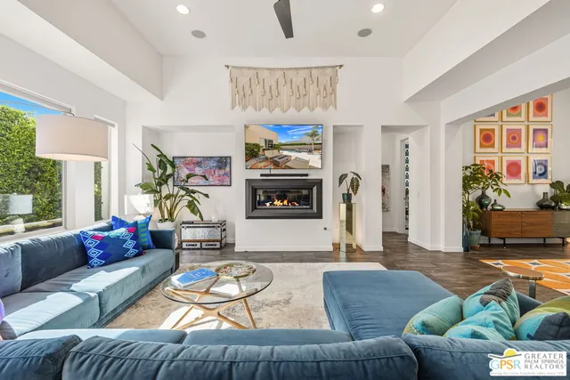 a living room with furniture or couch and a fireplace