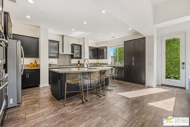 a backyard of a house with outdoor seating