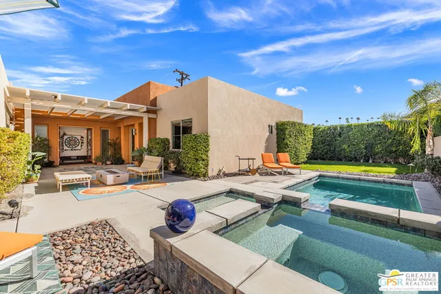 a view of swimming pool with seating space