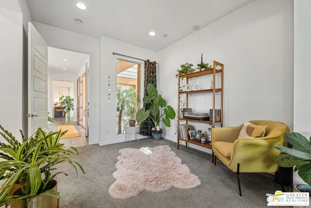 a living room with furniture and window