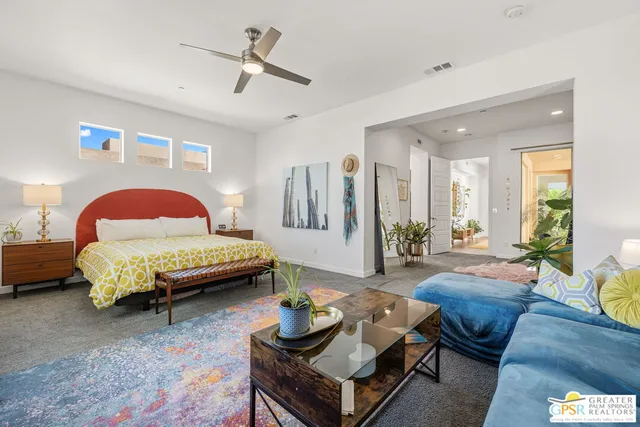 a spacious bathroom with a granite countertop tub shower and sink