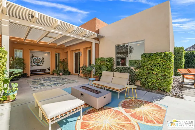 a balcony with furniture and a potted plant