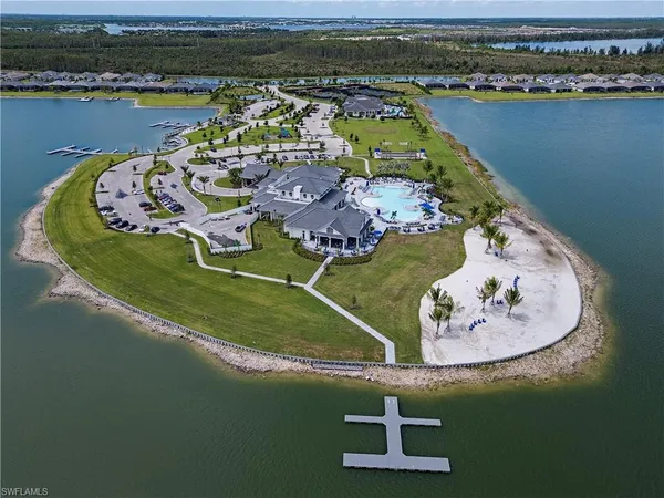 an aerial view of a house with a lake view