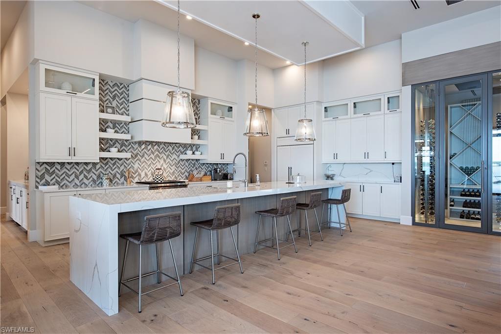 18354 Blue Eye Loop Fort Myers, FL 33913 - Photo 5 of 27 a large kitchen with cabinets and wooden floor