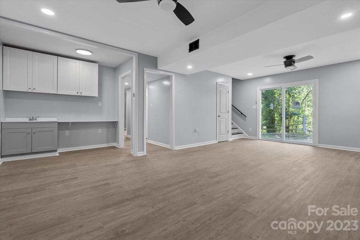 1500 Plumstead Road Charlotte, NC 28216 - Photo 21 of 30 a view of an empty room with a kitchen