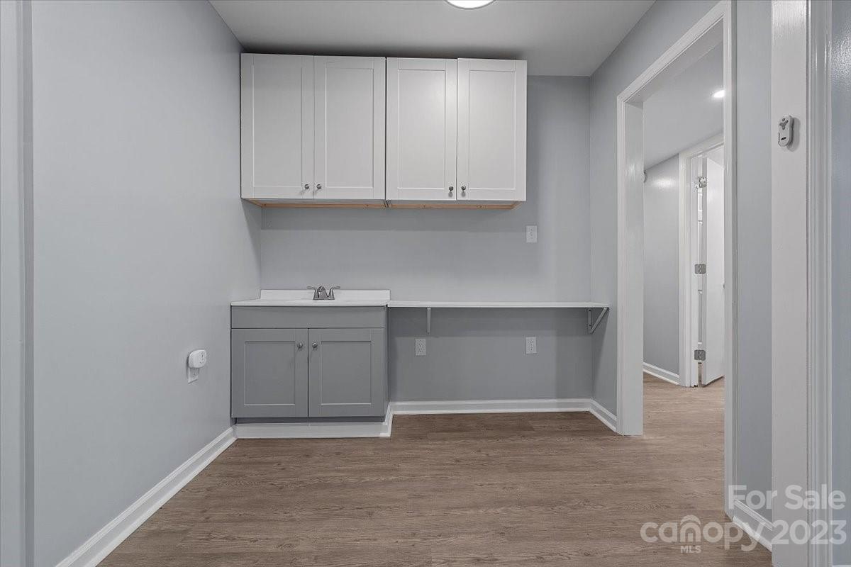 1500 Plumstead Road Charlotte, NC 28216 - Photo 22 of 30 a view of an empty room with dishwasher and a cabinet
