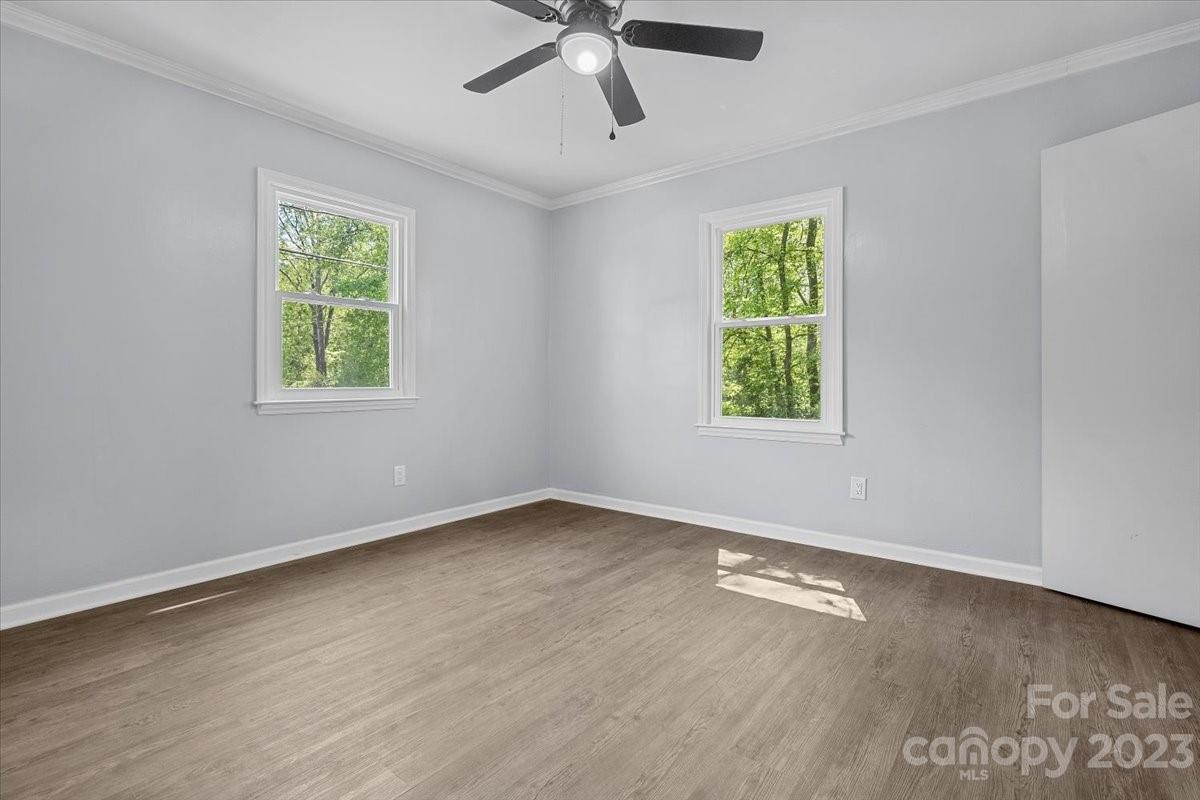 1500 Plumstead Road Charlotte, NC 28216 - Photo 24 of 30 wooden floor in an empty room with a window