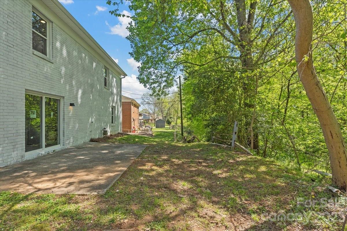 1500 Plumstead Road Charlotte, NC 28216 - Photo 27 of 30 a view of a house with backyard