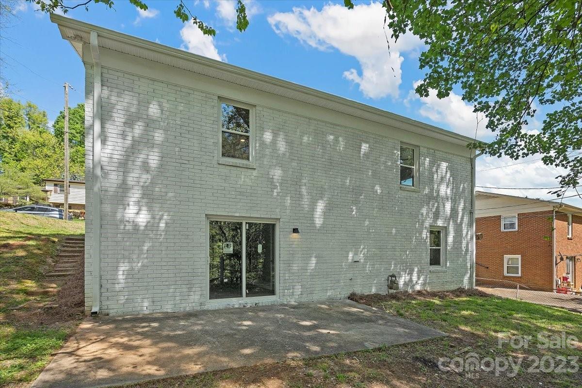 1500 Plumstead Road Charlotte, NC 28216 - Photo 28 of 30 a front view of a house with a yard