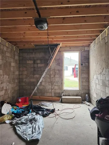 a room with pool table and a potted plant