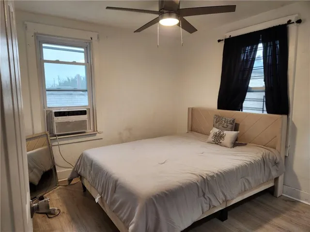 a bedroom with a bed and a window