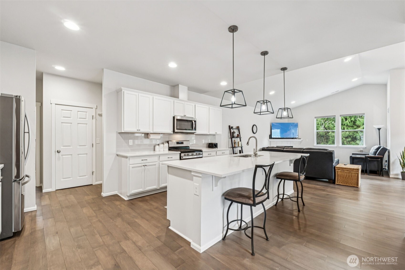 1028 Alpine View Drive Mount Vernon, WA 98274 - Photo 11 of 27 a large kitchen with white cabinets and stainless steel appliances