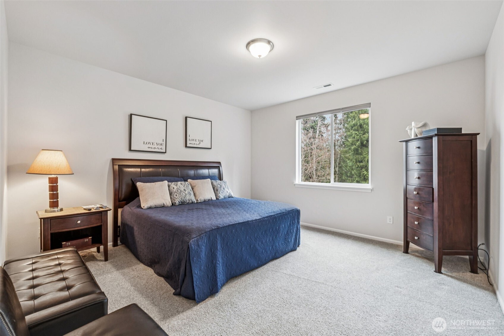 1028 Alpine View Drive Mount Vernon, WA 98274 - Photo 13 of 27 a bedroom with a bed and a lamp on table