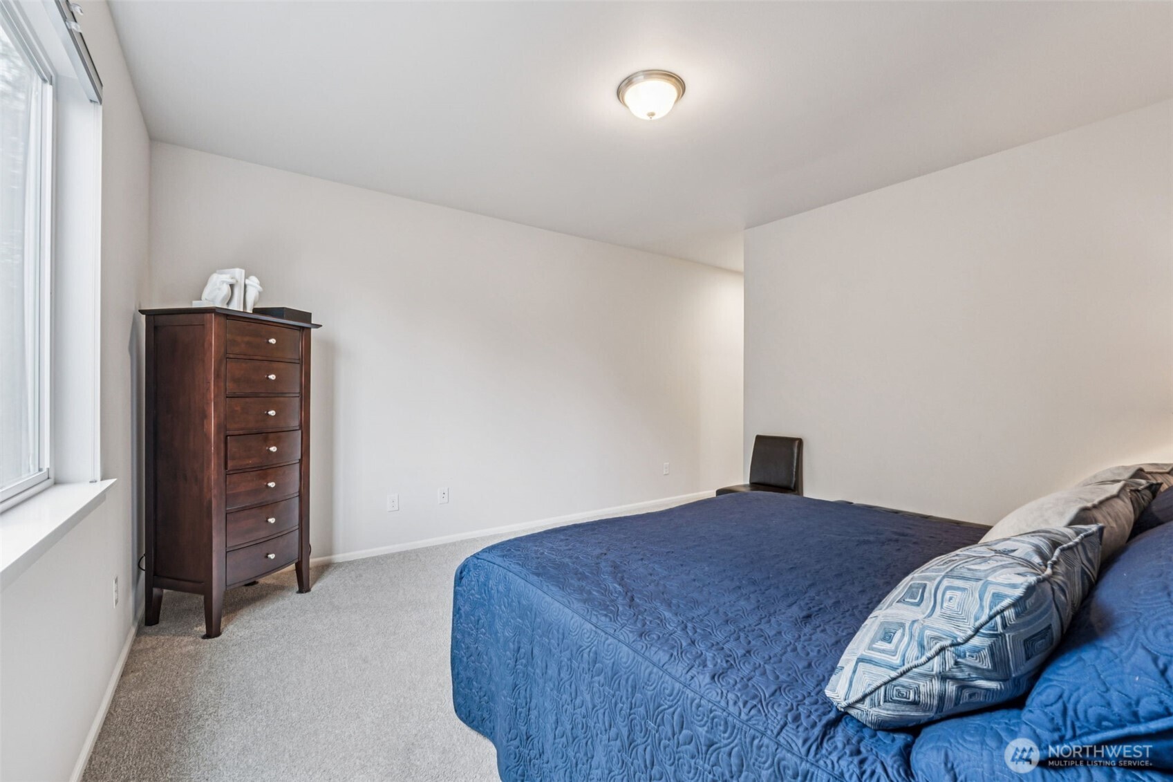 1028 Alpine View Drive Mount Vernon, WA 98274 - Photo 14 of 27 a bedroom with a bed and a dresser