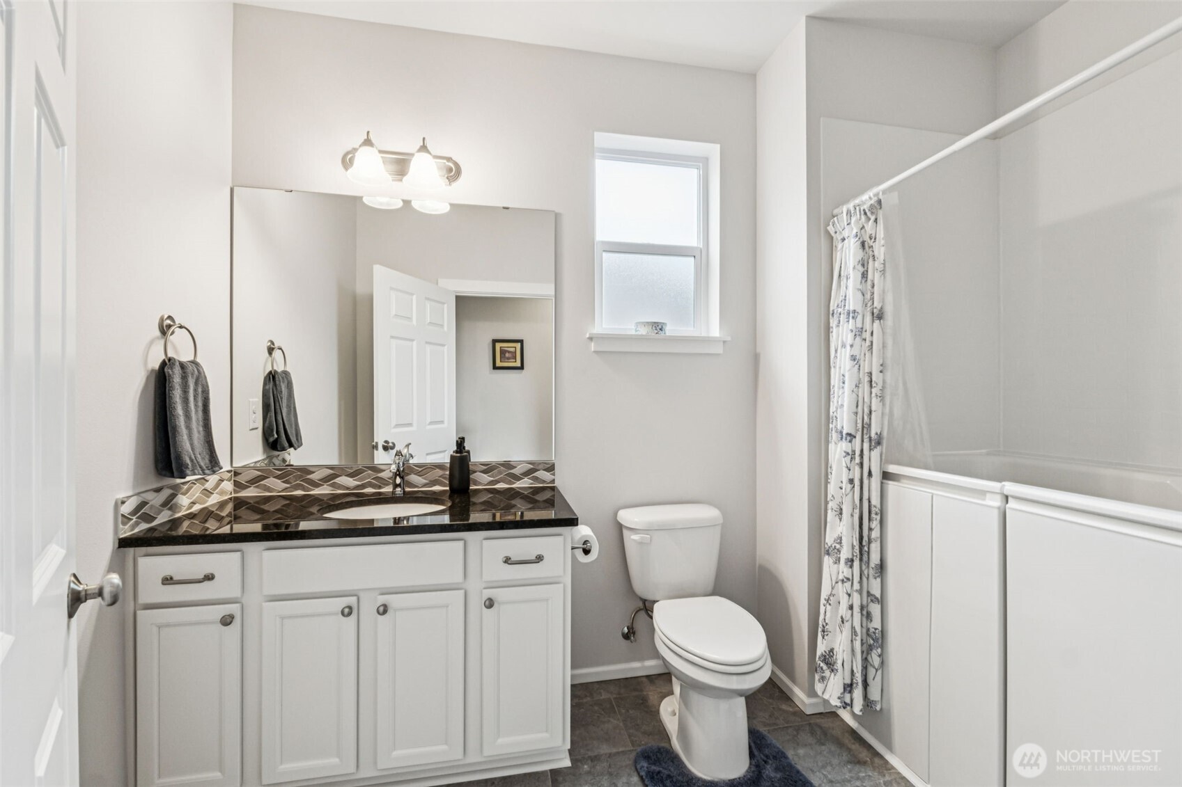 1028 Alpine View Drive Mount Vernon, WA 98274 - Photo 18 of 27 a bathroom with a toilet sink and mirror