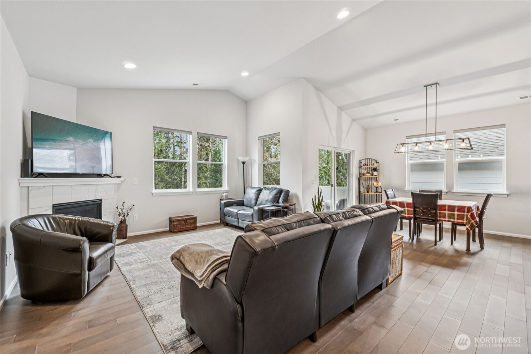 1028 Alpine View Drive Mount Vernon, WA 98274 - Photo 5 of 27 a living room with furniture a large window and a flat screen tv