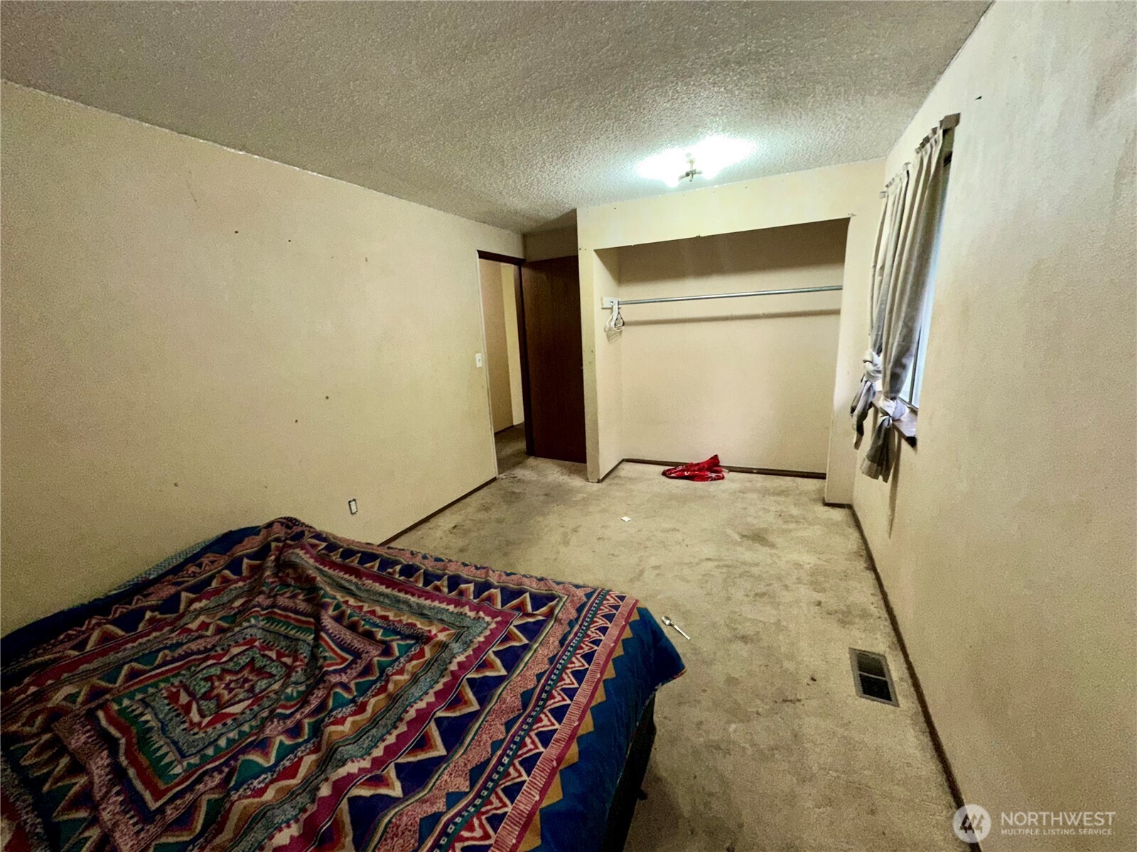 3936 Southwest 332nd Place Federal Way, WA 98023 - Photo 23 of 28 a bedroom with a bed and cabinets
