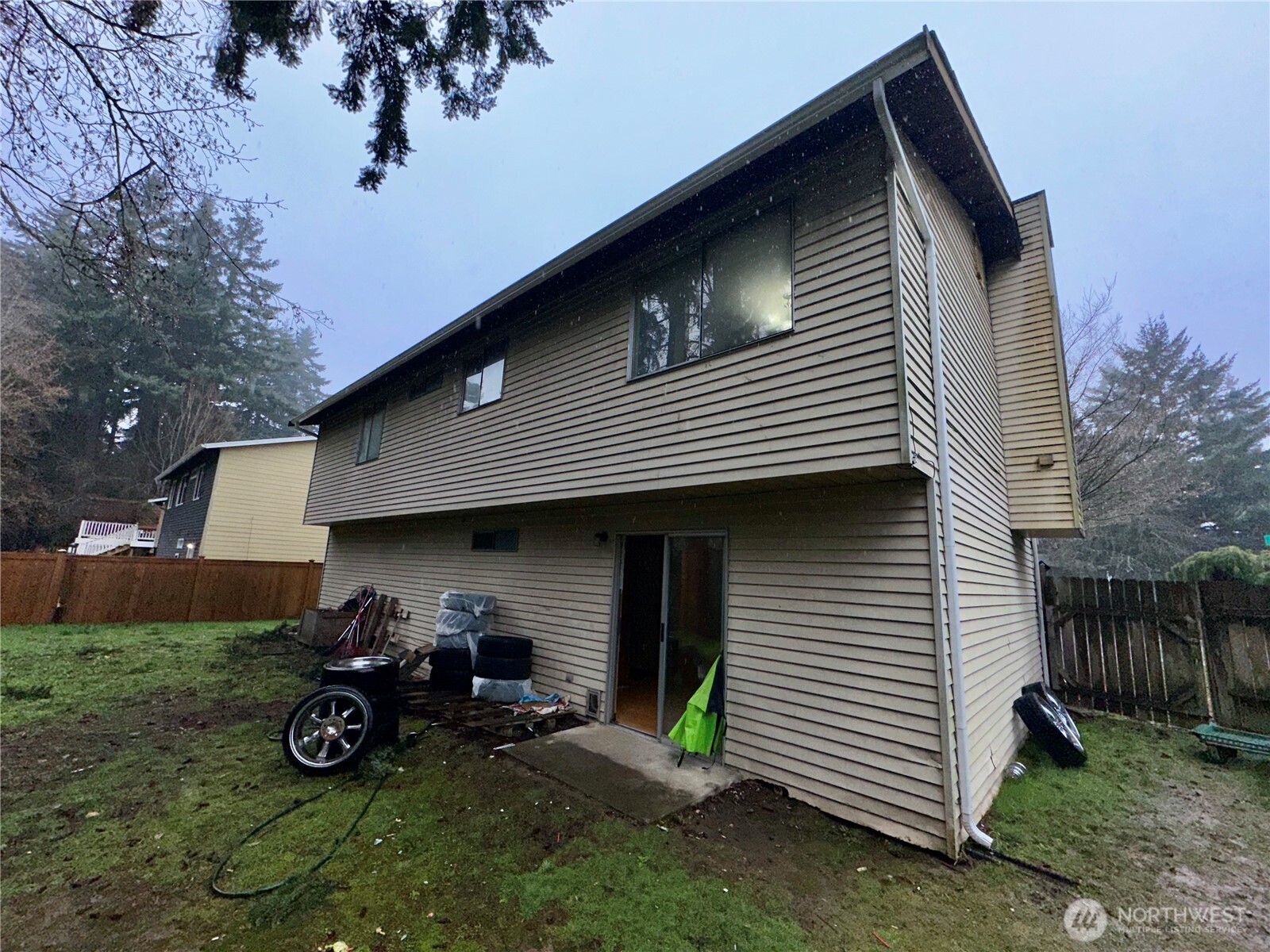3936 Southwest 332nd Place Federal Way, WA 98023 - Photo 8 of 28 a view of back yard of the house and car parked