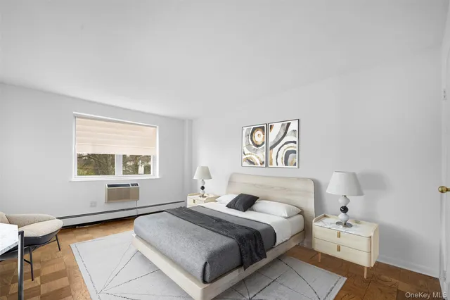 a bedroom with a bed and window