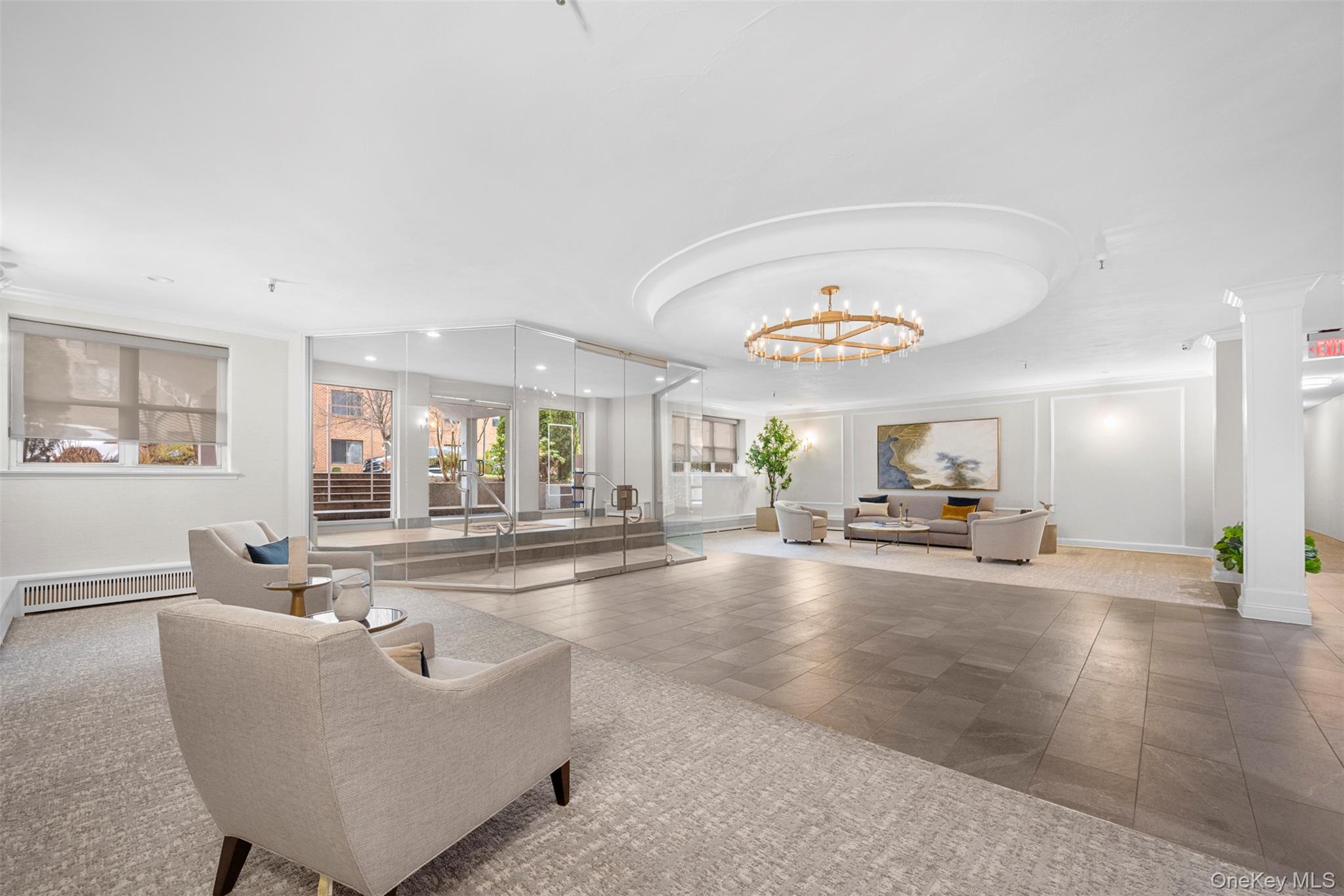 10 Ipswich Avenue, Unit 4M Great Neck, NY 11021 - Photo 22 of 25 a living room with furniture and a large window