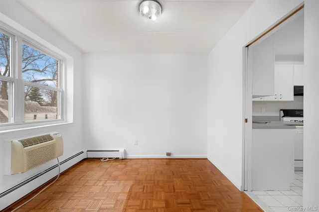a view of a kitchen with a sink refrigerator and window