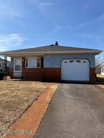 a view of a house with a snow in the yard