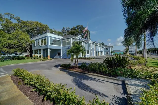 a view of a livingroom with furniture and a window