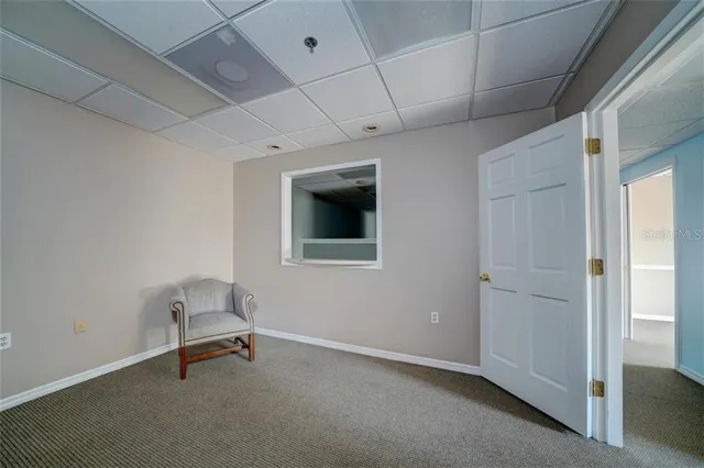 a white toilet sitting next to a shower