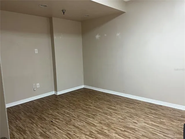a living room with furniture a large window and a flat screen tv