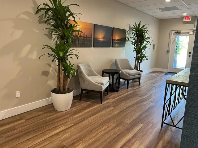 a view of entryway with wooden floor and stairs