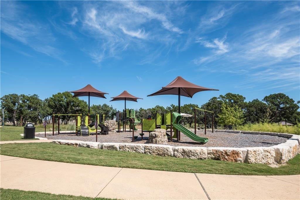 113 Cartwheel Bend, Unit 46 Austin, TX 78738 - Photo 6 of 10 Community play area featuring a lawn