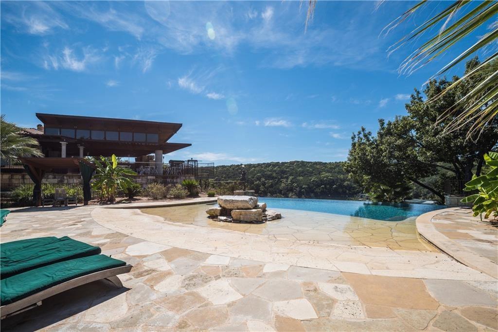 113 Cartwheel Bend, Unit 46 Austin, TX 78738 - Photo 7 of 10 View of pool featuring an infinity pool and patio surround