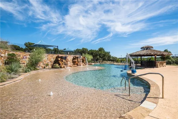 a view of a lake with a yard