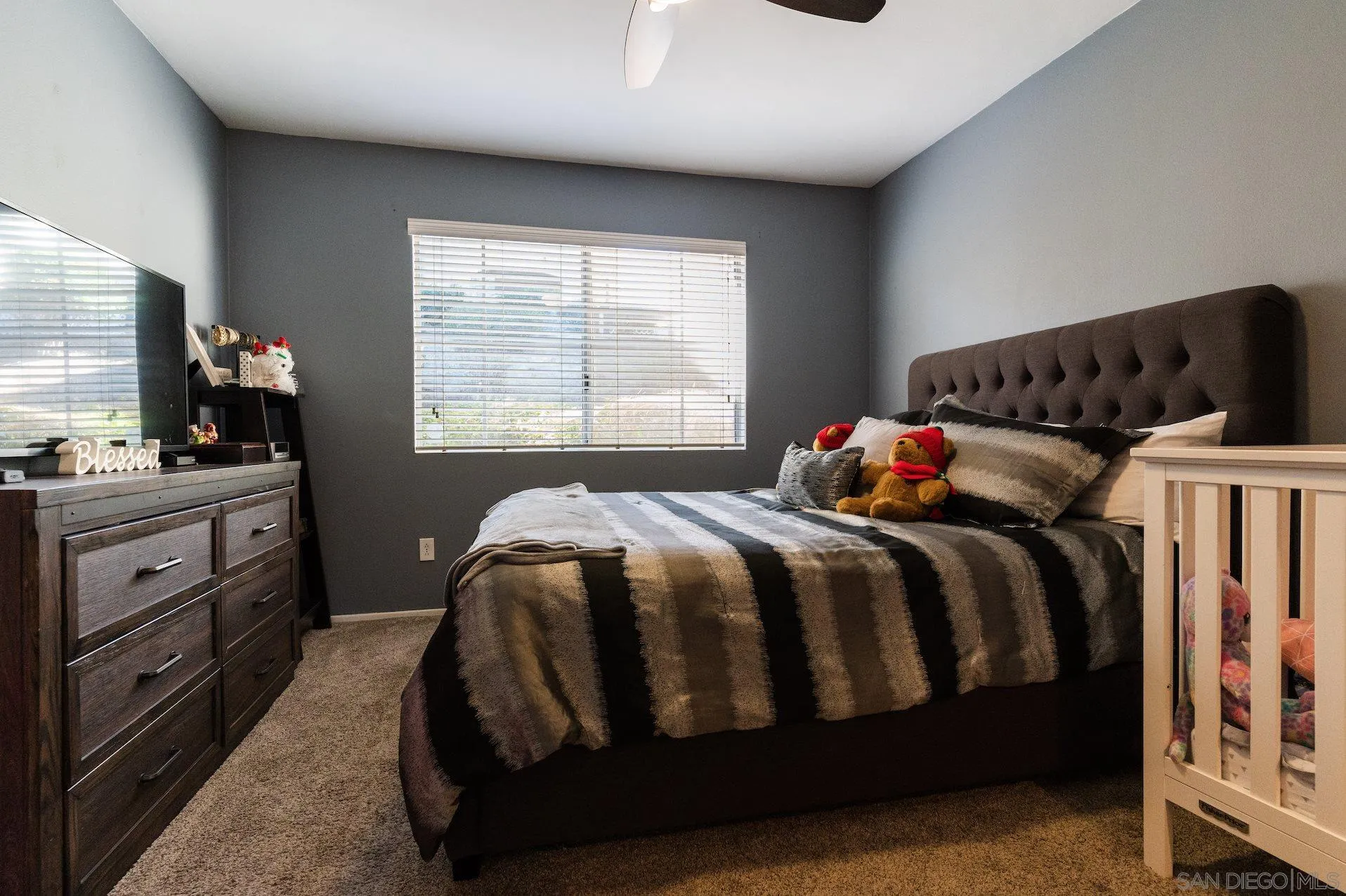 730 Brookstone Road, Unit 103 Eastlake, CA 91913 - Photo 12 of 25 a bedroom with a bed and a window