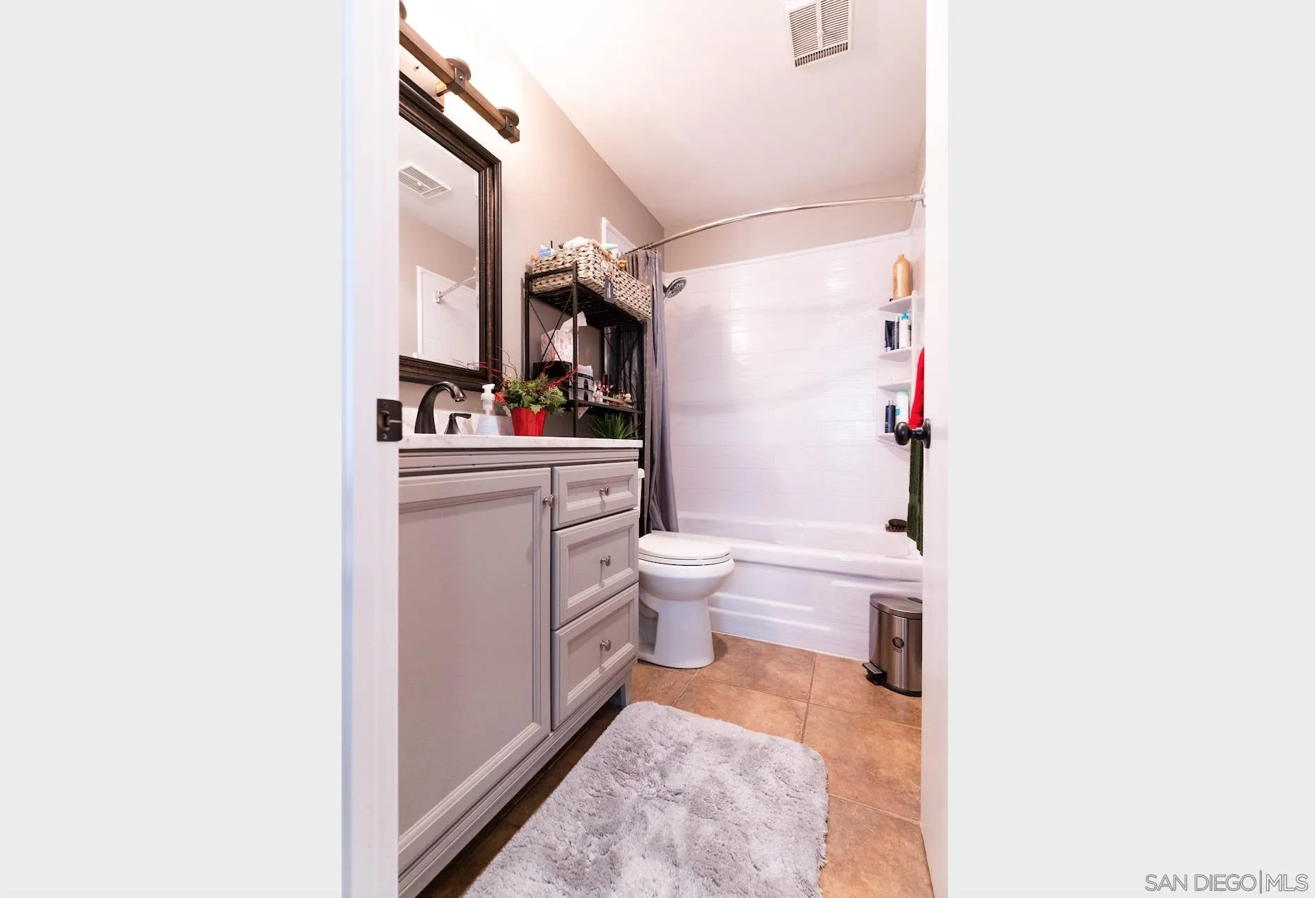 730 Brookstone Road, Unit 103 Eastlake, CA 91913 - Photo 13 of 25 a bathroom with a sink a toilet and a shower