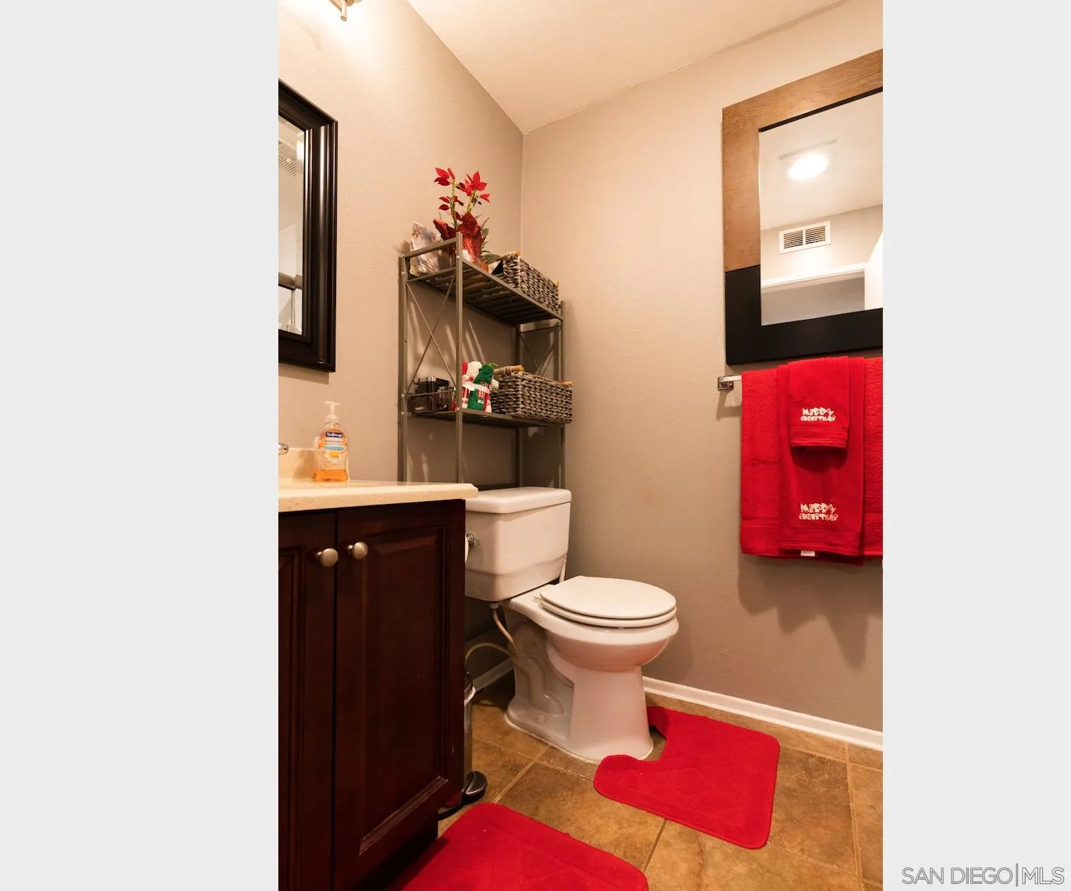 730 Brookstone Road, Unit 103 Eastlake, CA 91913 - Photo 14 of 25 a bathroom with a toilet a sink and mirror