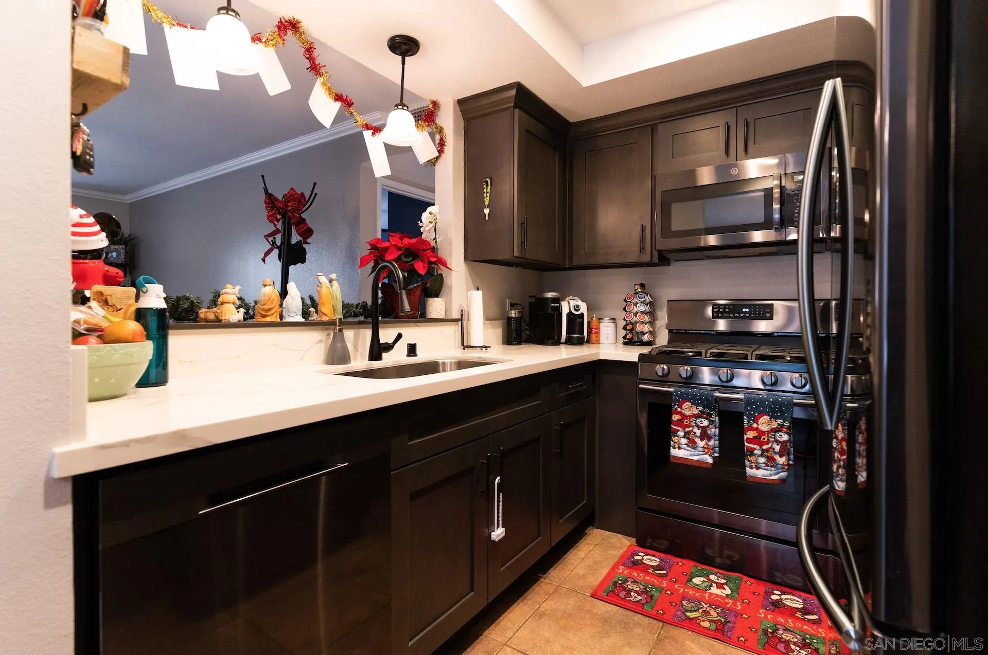 730 Brookstone Road, Unit 103 Eastlake, CA 91913 - Photo 2 of 25 a kitchen with stainless steel appliances a sink stove and cabinets