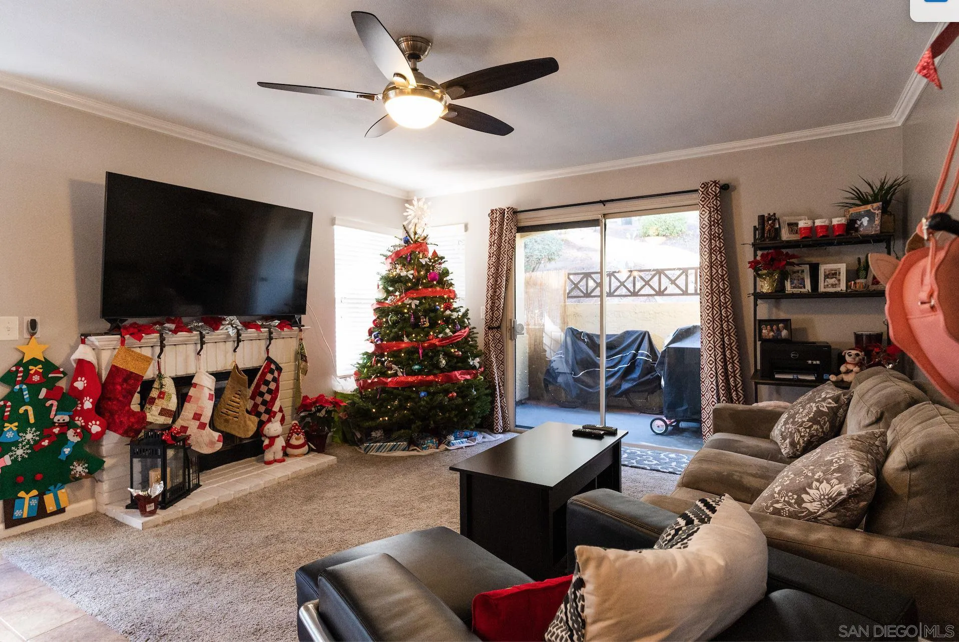 730 Brookstone Road, Unit 103 Eastlake, CA 91913 - Photo 3 of 25 a living room with furniture and a flat screen tv