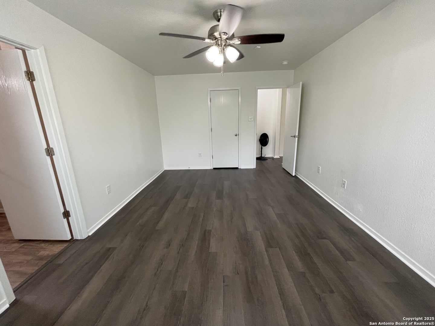 10014 Raspberry Oak San Antonio, TX 78223 - Photo 11 of 20 a view of empty room with wooden floor