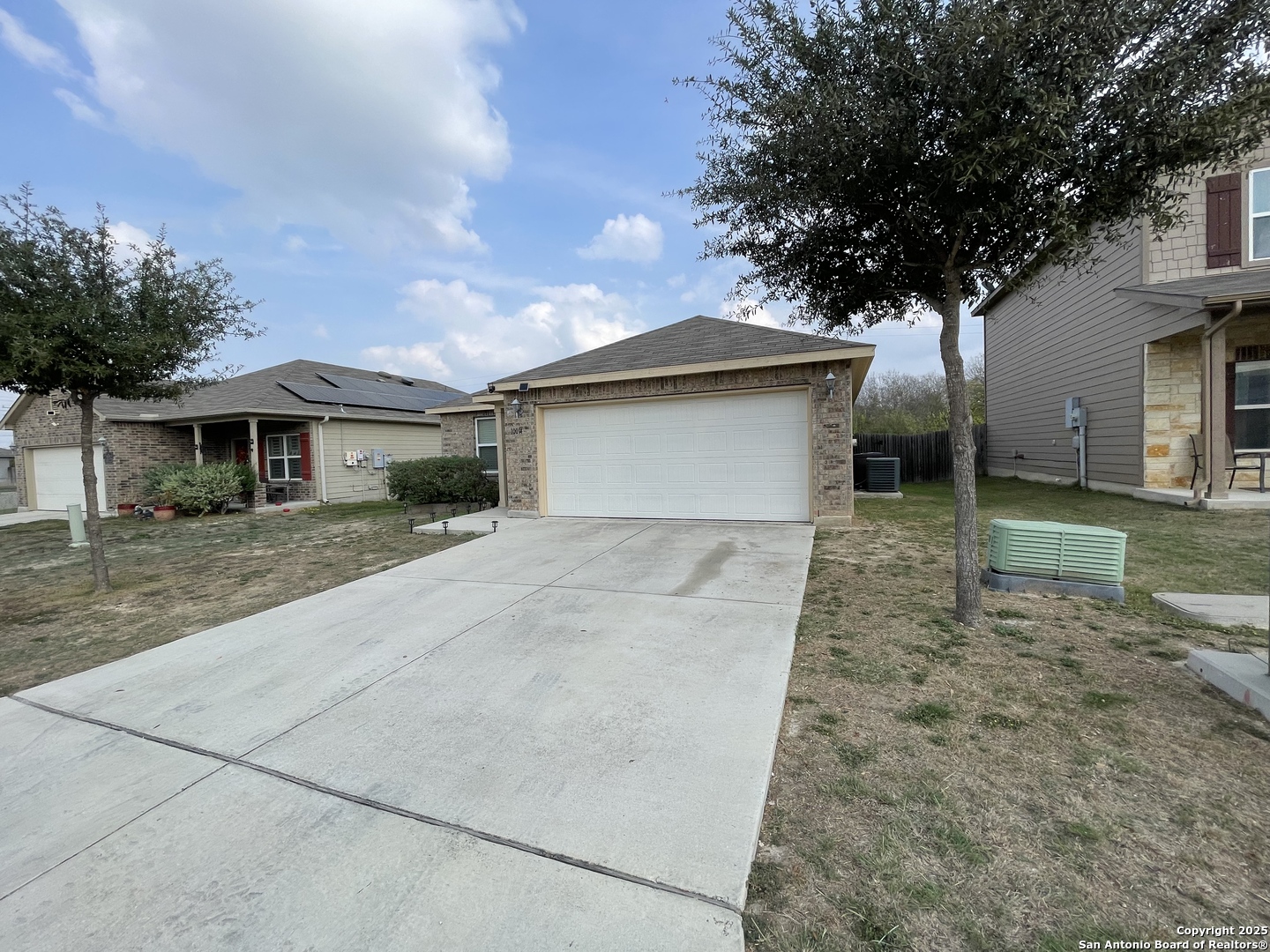 10014 Raspberry Oak San Antonio, TX 78223 - Photo 2 of 20 a front view of a house with garden