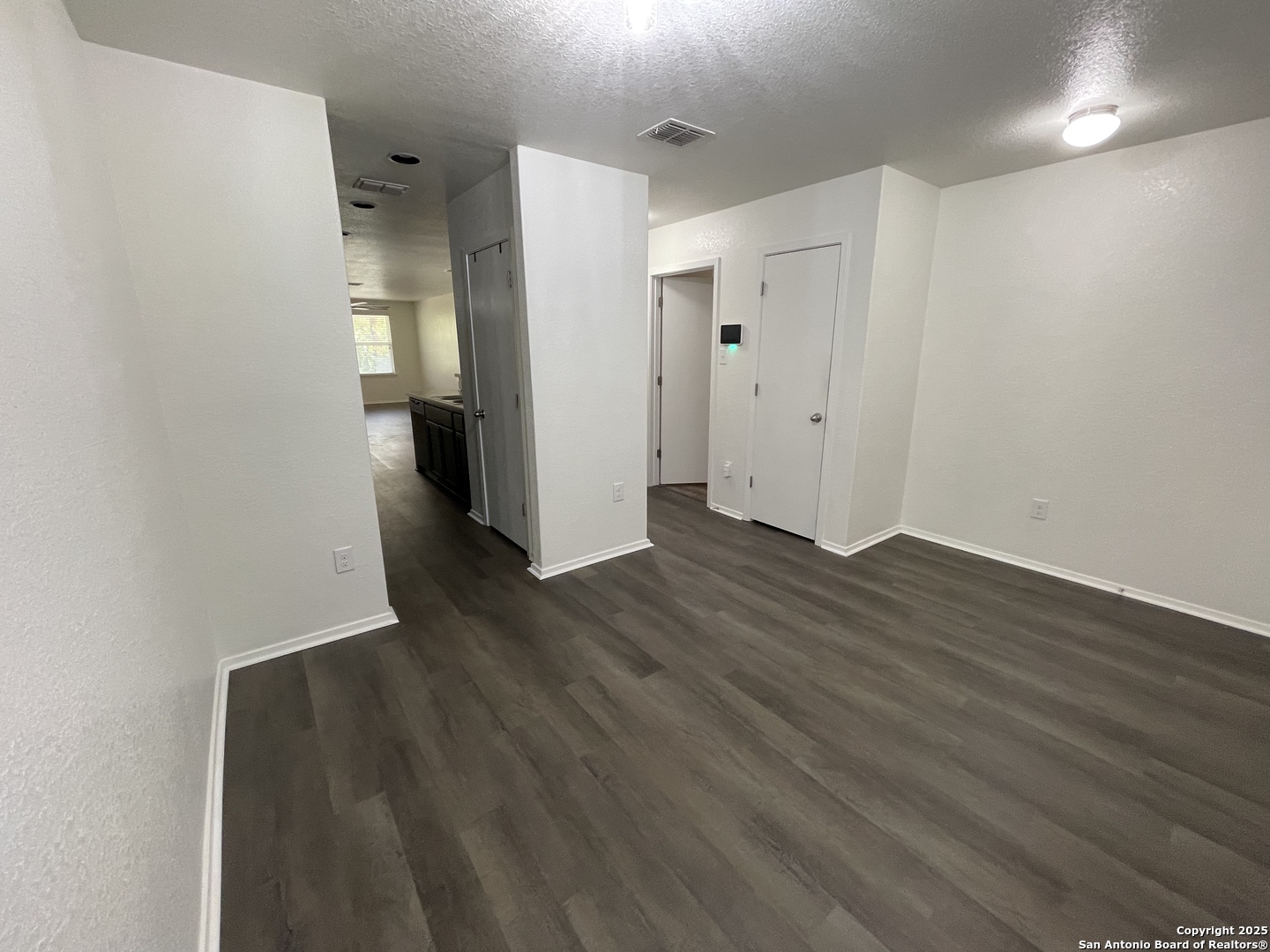 10014 Raspberry Oak San Antonio, TX 78223 - Photo 5 of 20 a view of a hallway with wooden floor