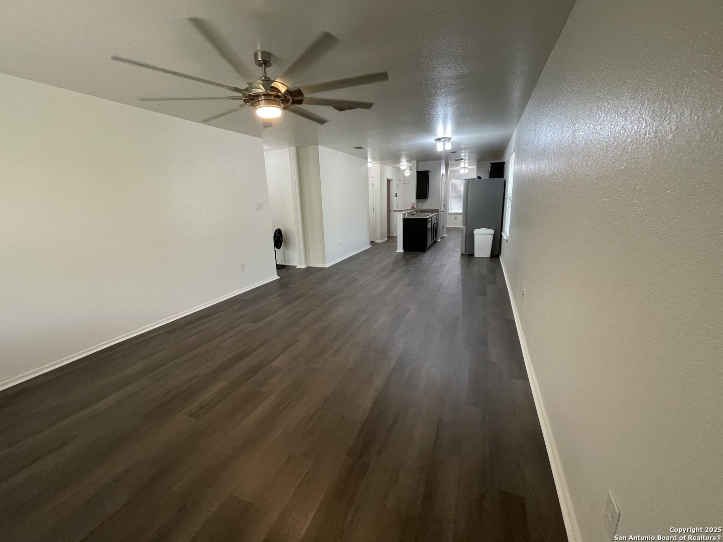 10014 Raspberry Oak San Antonio, TX 78223 - Photo 9 of 20 a view of an empty room with wooden floor