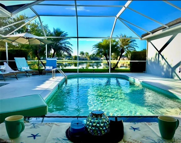 a view of a chair and tables in the patio