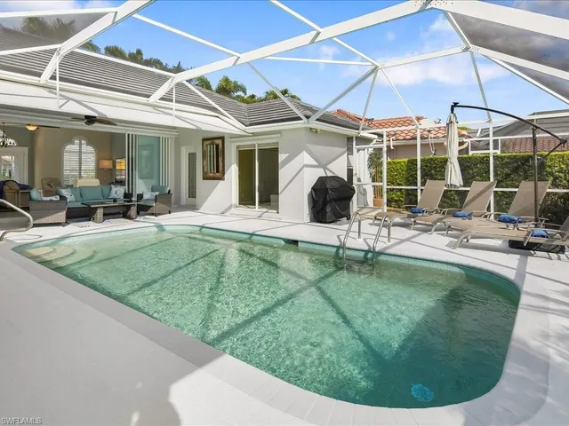 a view of a house with backyard sitting area and garden