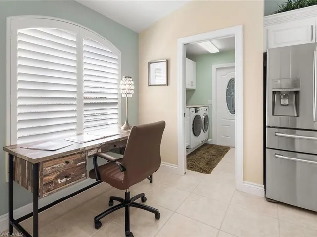 a workspace with furniture and a window