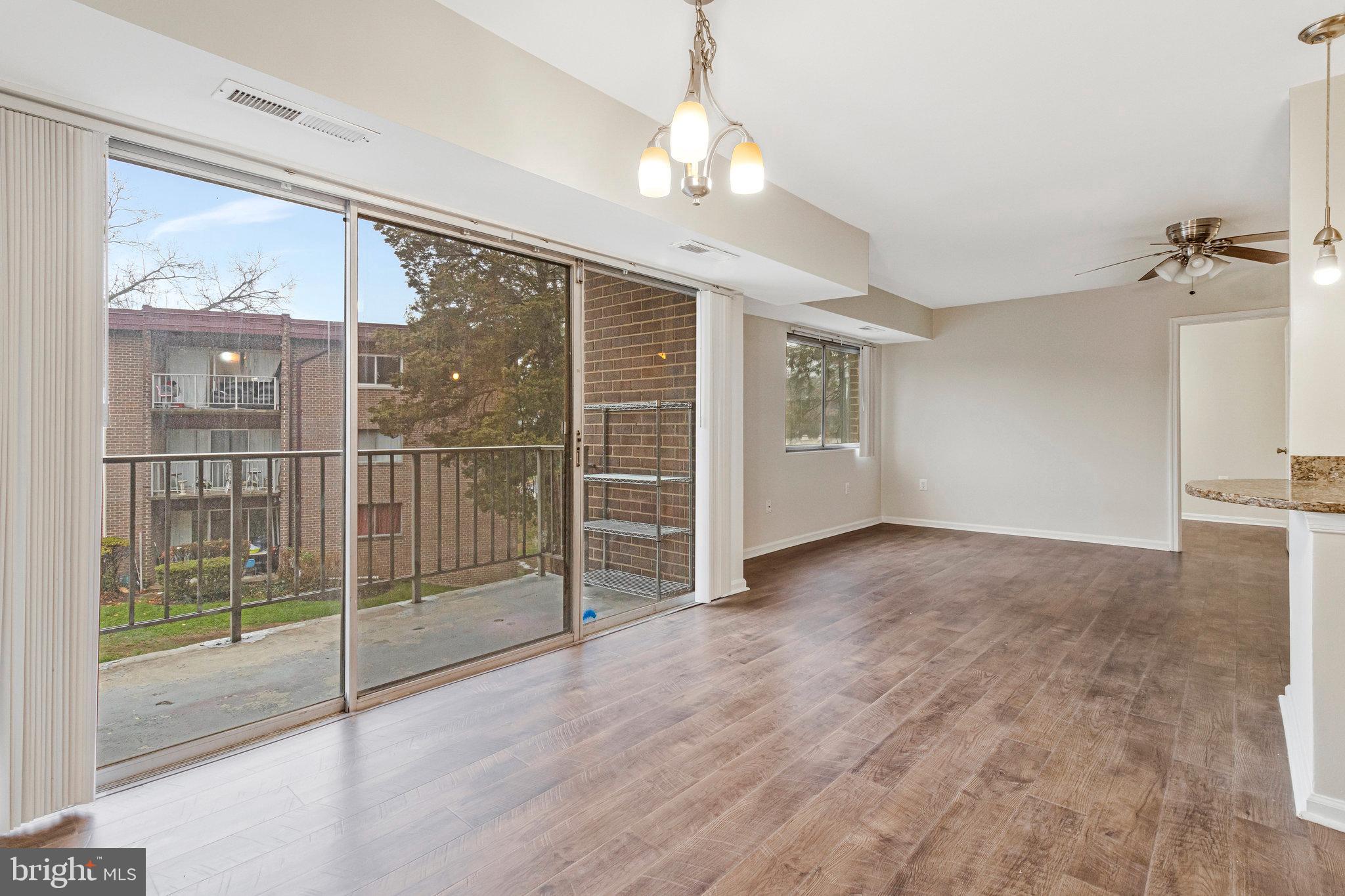 3802 Bel Pre Road, Unit 38025 Silver Spring, MD 20906 - Photo 14 of 36 a view of a room with balcony and front door