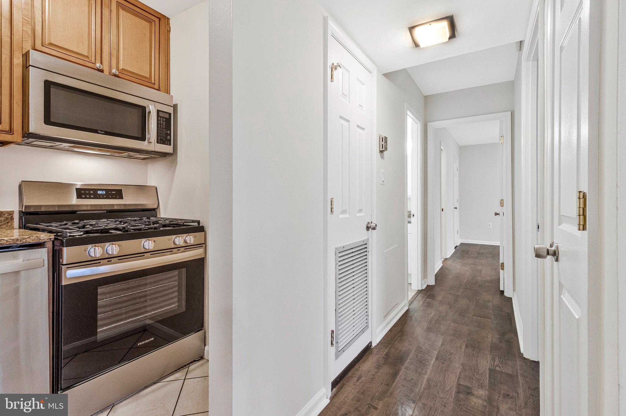 3802 Bel Pre Road, Unit 38025 Silver Spring, MD 20906 - Photo 19 of 36 a view of a kitchen from the hallway